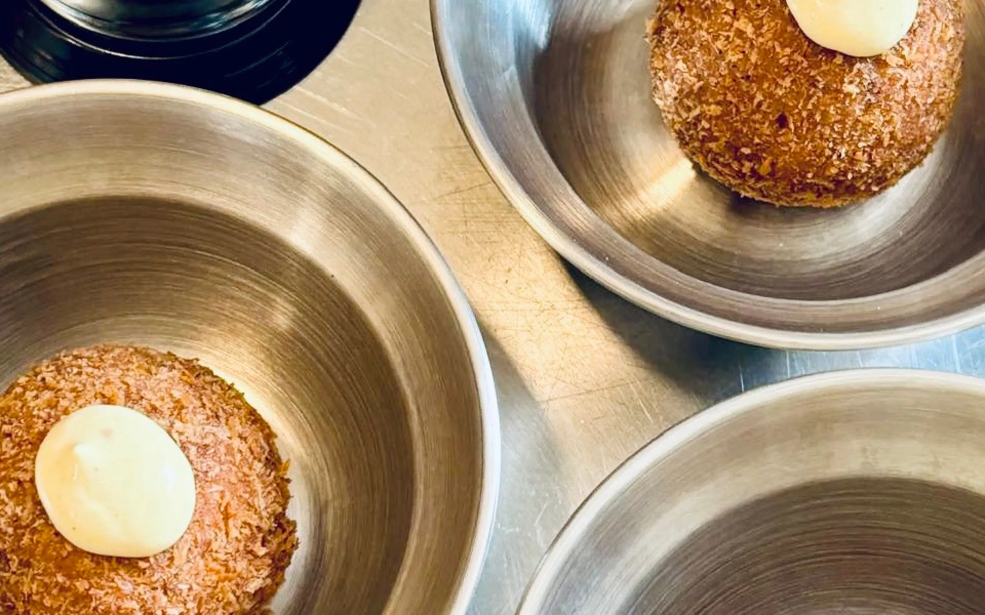 Mushroom croquettes being plated in the kitchen as MAFFOOD takes over Café Keulen for an evening of food and design.