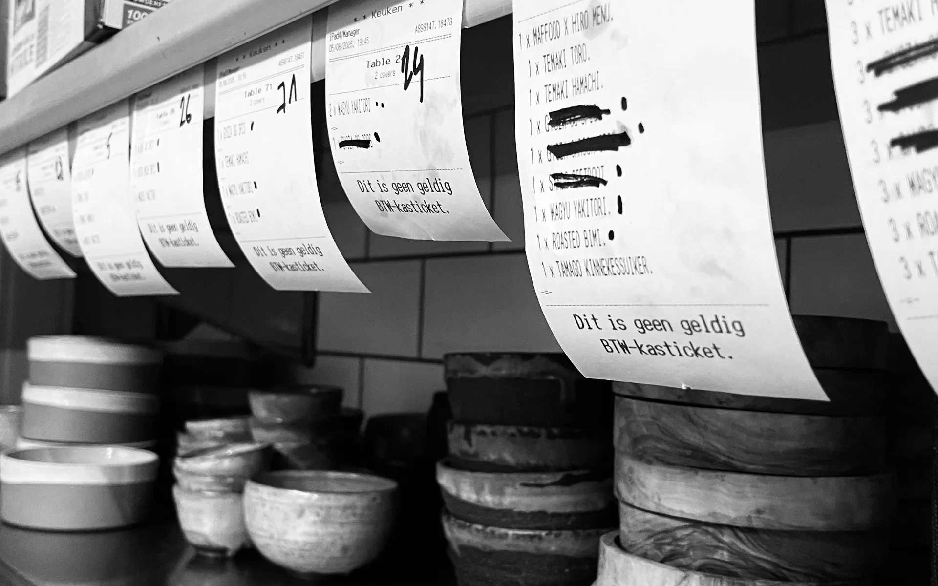 Kitchen orders lining up during a fast-paced MAFFOOD dinner service at Hiro
