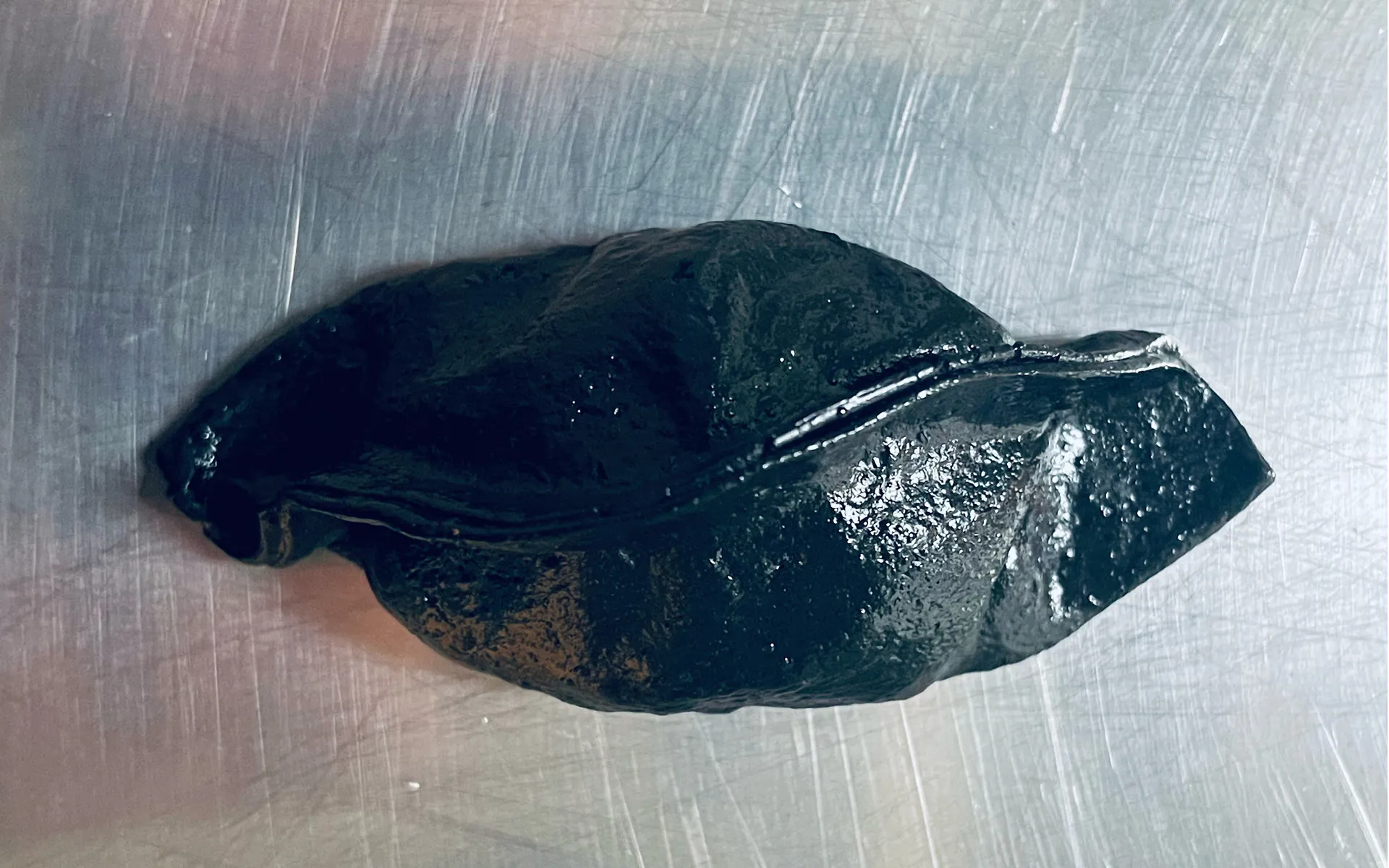A close-up of MAFFOOD's signature black gyoza, created for the Gallery Collective opening during Antwerp Art Weekend.