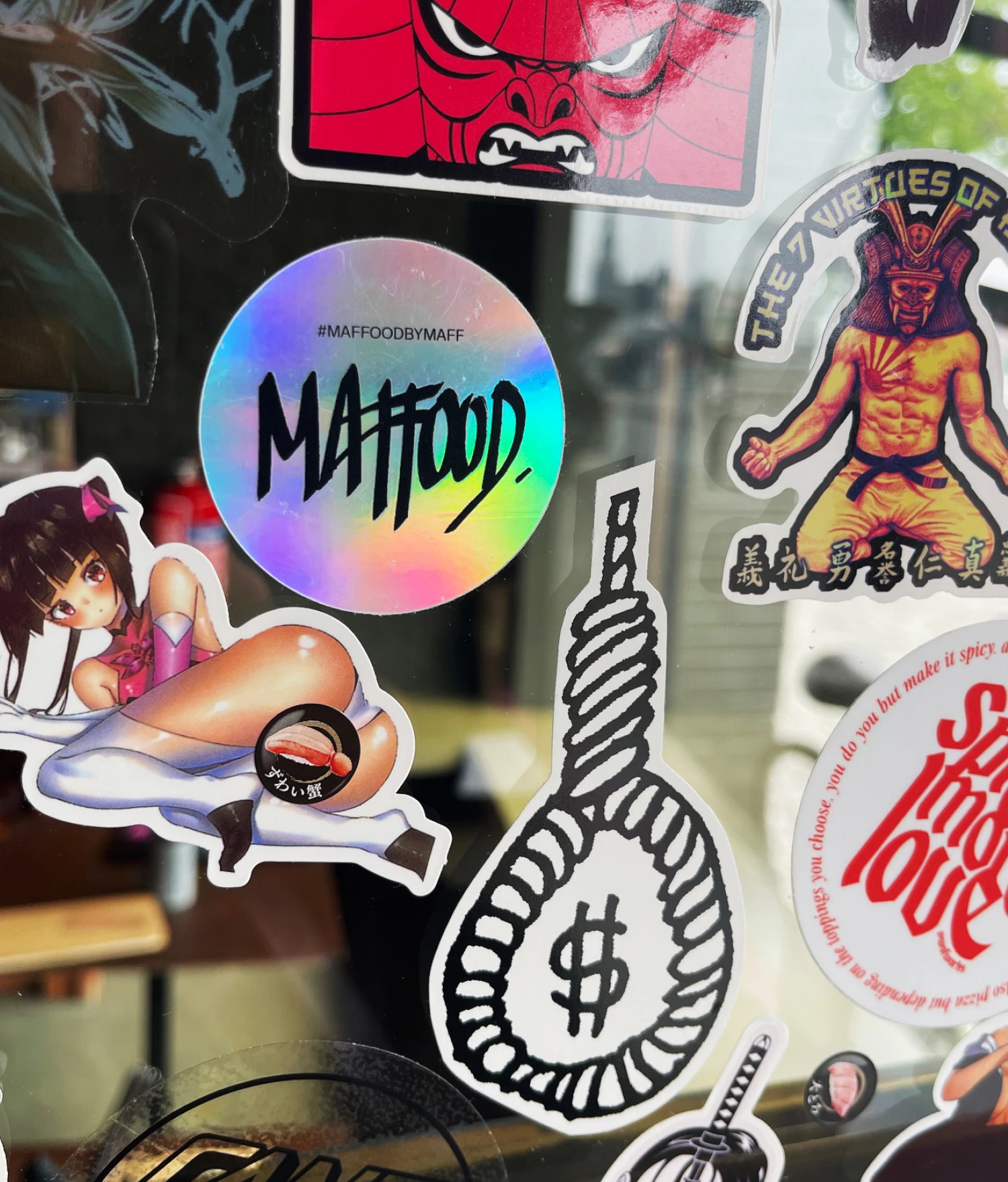 maffood sticker on the hiro door